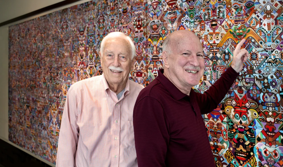 Bill and John in front of art