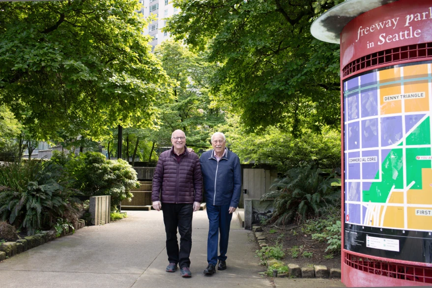 Bill and John walking in the park