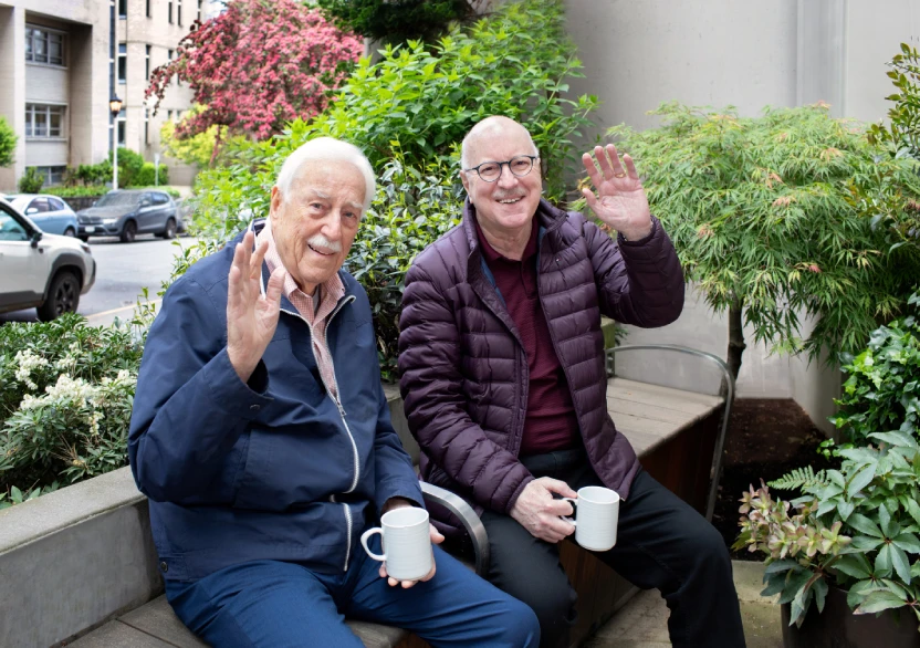 Bill and John drinking coffee on the patio